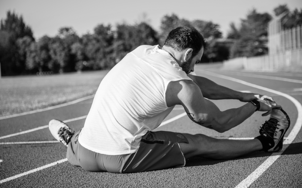 Man Stretching | Tigard Chiropractor | Rhodes Chiropractic